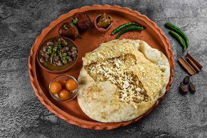 Picture of Paneer Stuffed 2pc Bhature With Chole & Masala Aloo+ Lassi + Gulab Jamun (no Onion Garlic)